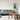 gray 2 seat sofa near brown wooden coffee table